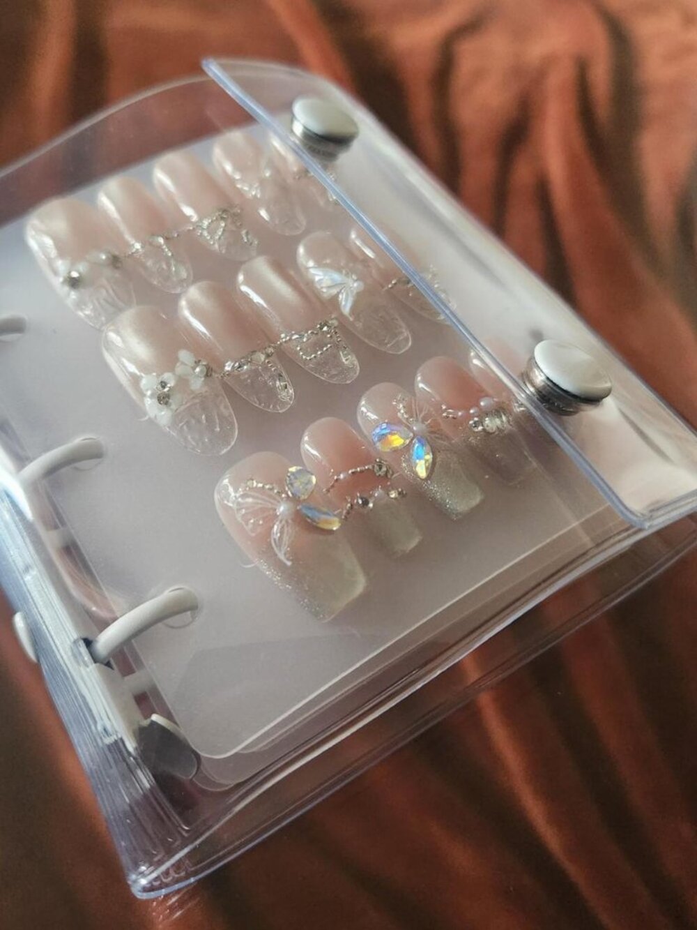 Small pre-filled coquette & fairy press-on nails storage binder. Size M.